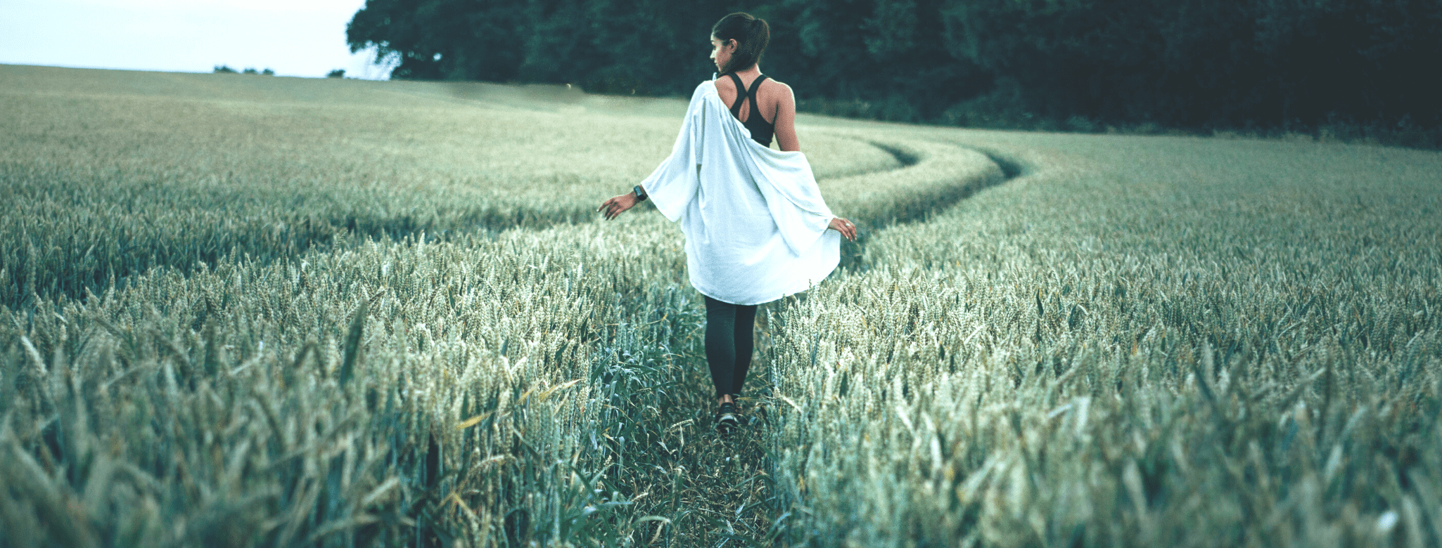 girl walking in a field peacefully